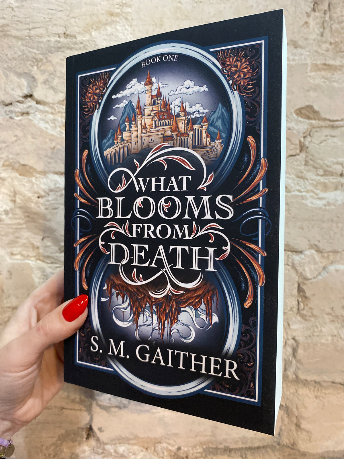 What Blooms From Death by S. M. Gaither