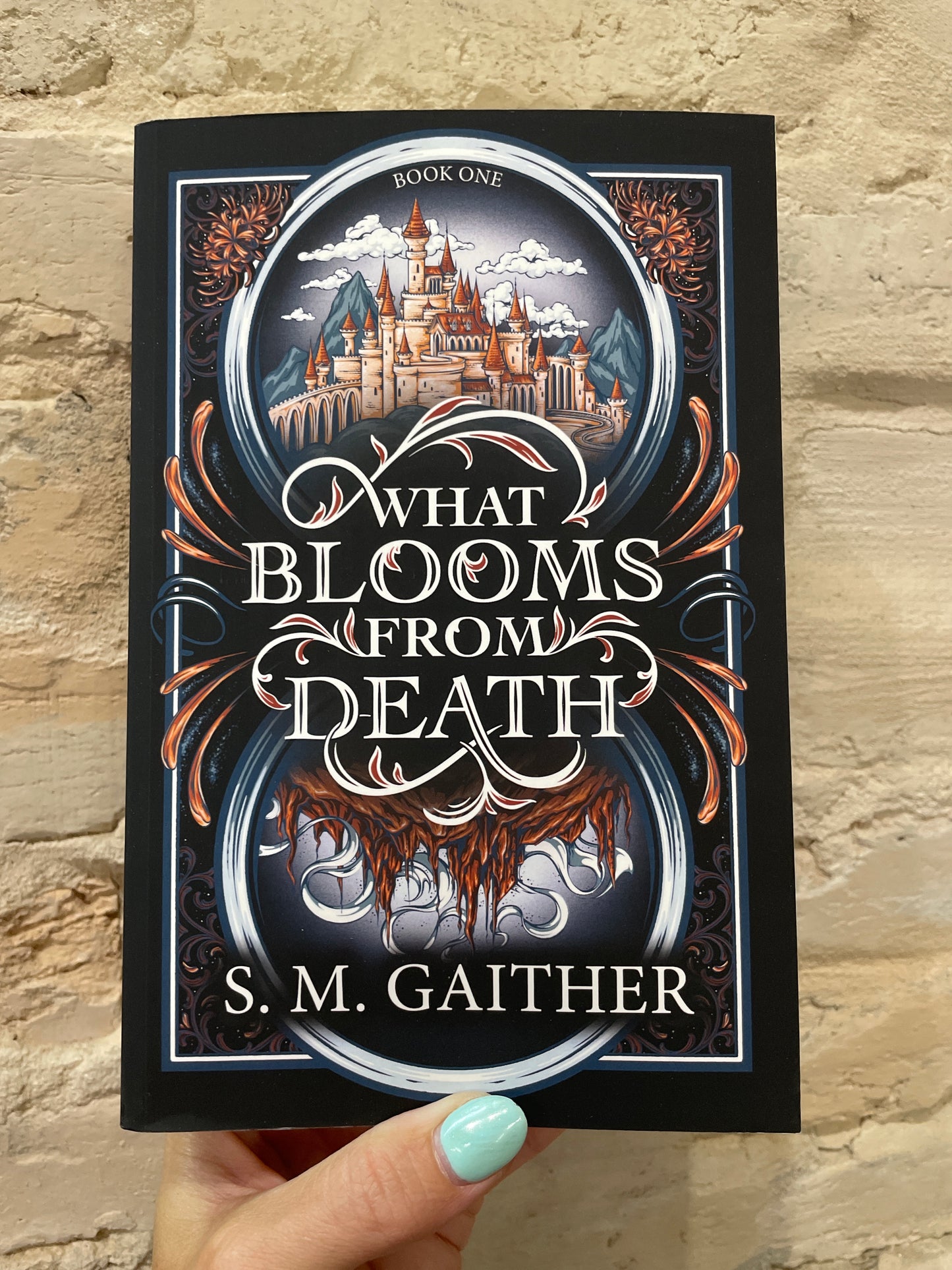 What Blooms From Death by S. M. Gaither